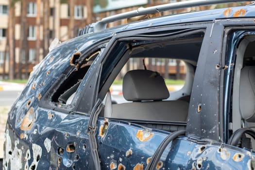 Car riddled with bullets. War of Russia against Ukraine. A car of civilians shot by the Russian military during the evacuation of women and children. Traces of bullets and fragments of shells