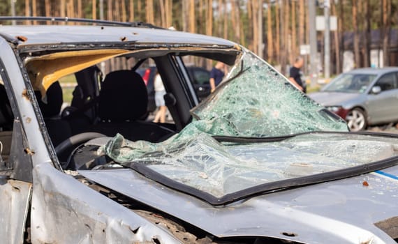 Car riddled with bullets. War of Russia against Ukraine. A car of civilians shot by the Russian military during the evacuation of women and children. Traces of bullets and fragments of shells