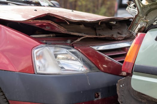 Traffic accident on the street, damaged car after a collision in the city. Accident due to speeding and alcohol intoxication. Transport background. The concept of road safety and insurance