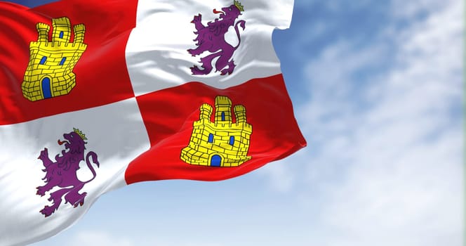 The Castile and Leon flag waving in the wind on a clear day. Castile and Leon is an autonomous community in north-western Spain.