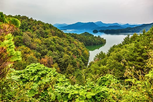 Mountains with green trees and lake landscape in South Korea