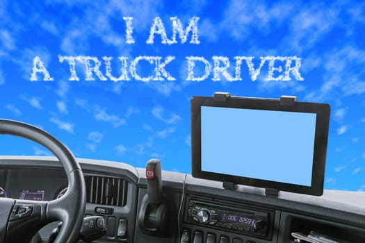 Dashboard of the truck with blue sky in front of the car. The inscription I AM A TRUCK DRIVER is formed from clouds in the blue sky. Navigation display is colored in light blue and is ready for your text.