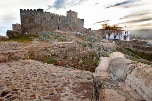 Montanchez town castle remains and hermitage at sunrise, Caceres, Spain