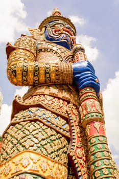 The characters from the Ramakian appear frequently in temple paintings and in murals surrounding the galleries of the Temple of the Emerald Buddha. Yaksha statues are usually stationed facing the gates, with their backs to the temple they guard. At Wat Phra Kaew, there is an exception as they face the shrine of the Emerald Buddha to protect the Emerald Buddha.