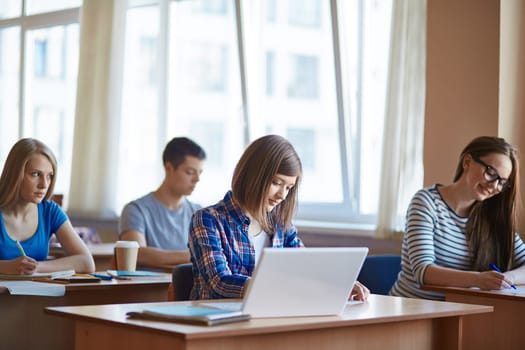 Highschool students working on their own at lesson
