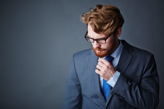 Pensive businessman in elegant suit