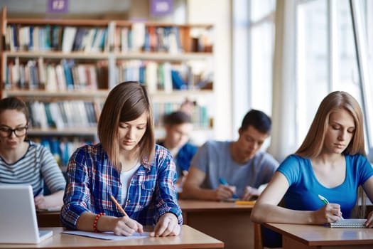 Highschool students carrying out written task