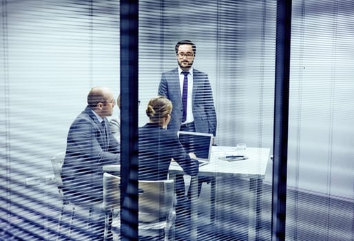 Serious co-workers having consultation in office