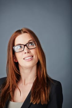 Young businesswoman in formalwear and eyeglasses