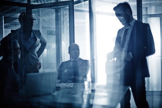 Business team consulting or planning work at meeting