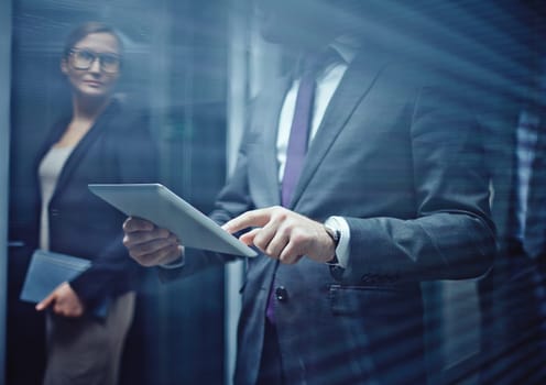 Close-up of businessman using touchpad on background of woman