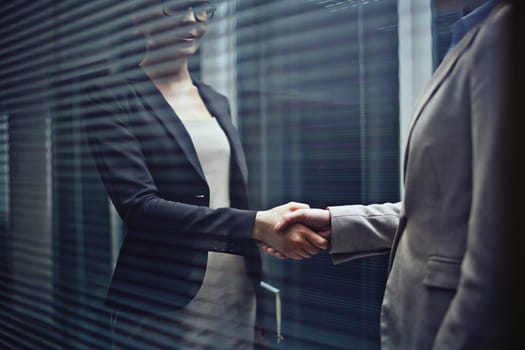 Close-up of businesswomen handshaking