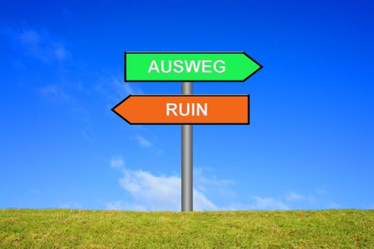 Signpost points in two directions: way out ruin