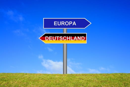 Signpost points in two directions: Europe Germany