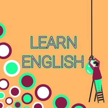Sign displaying Learn English, Business overview Universal Language Easy Communication and Understand Businessman Standing Ladder Fixing Light Bulb Generating New Futuristic Ideas.