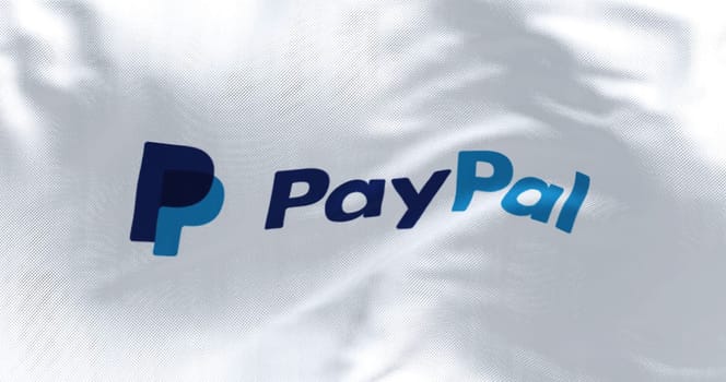 New York, USA, June 2022: flag with the Paypal logo waving in the wind. Paypal is an American multinational financial technology company
