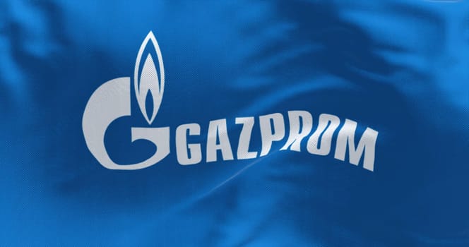 Moscow, RUS, June 2022: blue flag with the Gazprom logo waving in the wind. Gazprom is a Russian majority state-owned multinational energy corporation