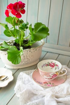 Women holidays concept. Vintage cup with flowers. Vertical image