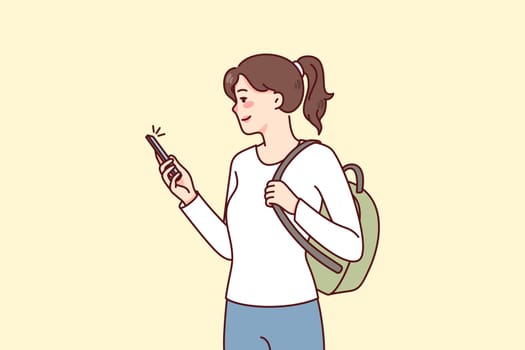 Smiling girl student with backpack using modern smartphone communicating online. Happy woman with cellphone browsing social networks on gadget. Flat vector illustration.