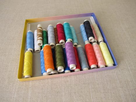 Sewing thread in different colors in a box