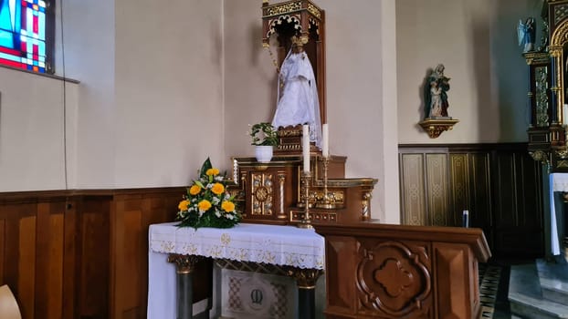 ROSPORT, LUXEMBURG  - APRIL 16, 2022:.Rosport, Luxemburg - April 16, 2022:.In the parish church of Rosport near the Tudor Museum on the border between Luxembourg and Germany