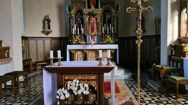 ROSPORT, LUXEMBURG  - APRIL 16, 2022:.Rosport, Luxemburg - April 16, 2022:.In the parish church of Rosport near the Tudor Museum on the border between Luxembourg and Germany