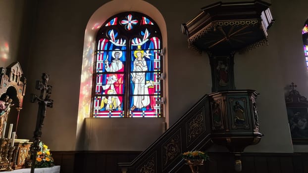 ROSPORT, LUXEMBURG  - APRIL 16, 2022:.Rosport, Luxemburg - April 16, 2022:.In the parish church of Rosport near the Tudor Museum on the border between Luxembourg and Germany