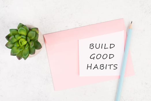 The words build good habits are standing on a paper, change lifestyle, healthy and positive attidude, motivation concept