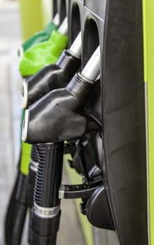 Detail of manual pumps to put gasoline in a vehicle