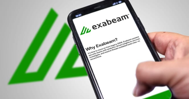 San Francisco, USA, June 2022: hand holding a phone with Exabeam mobile application on screen. Exabeam is a leading provider of the software for analyzing user and company behavior