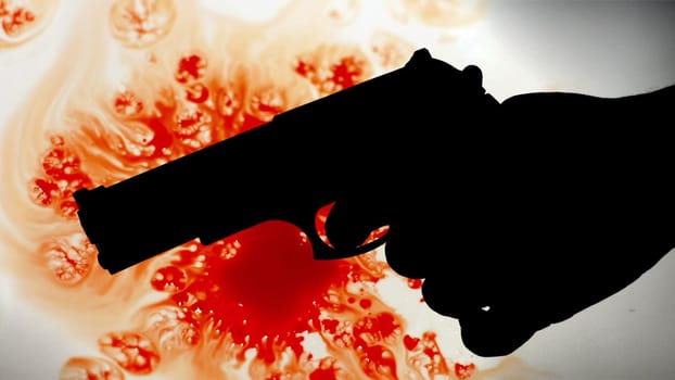 Pistol silhouette agains bloody background