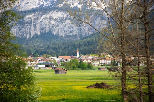 Small village in Austria with the Alps mountains in the background.