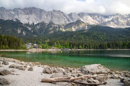 Faboulus landscape of Eibsee Lake with turquoise water in front of Zugspitze summit, Garmisch-Partenkirchen, Bavarian alps, Germany, Europe