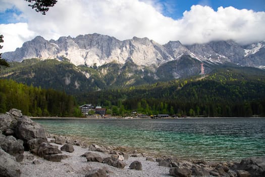 Faboulus landscape of Eibsee Lake with turquoise water in front of Zugspitze summit, Garmisch-Partenkirchen, Bavarian alps, Germany, Europe