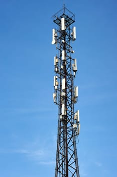 cell phone tower on a blue sky background. High quality photo