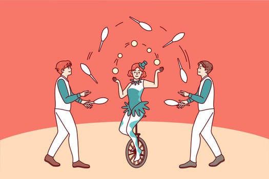 Artists juggling in circus