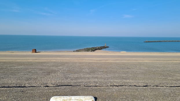 View of the resort of Port Zelande and its surroundings of the lake and dunes under a partly blue sky
