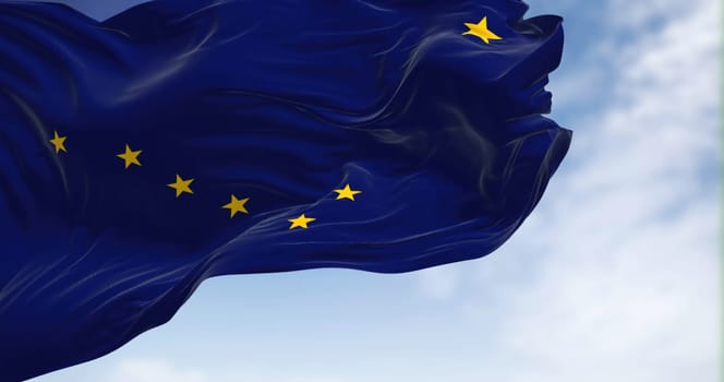 The state flag of Alaska waving in the wind. Alaska is a U.S. state located in the Western United States on the northwest extremity of North America. Democracy and independence. American state.