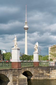 Schlossbruecke, Castle bridge by the architect Schinkel in Berlin. In the background the television tower.