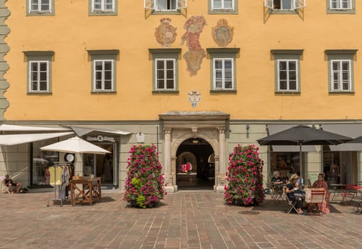people sit in front of a street cafe, Klagenfurt, Carinthia, Austria