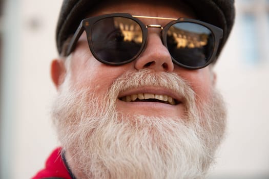 Headshot from friendly male man with big white beard