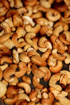 Backed cashews close up background modern high quality print Anacardium occidentale family anacardiaceae
