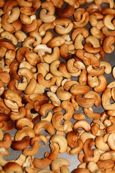 Backed cashews close up background modern high quality print Anacardium occidentale family anacardiaceae