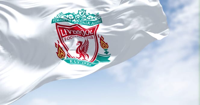 Liverpool, UK, May 2022: The flag of Liverpool Football Club waving in the wind on a clear day. Liverpool F.C. is a professional football club based in Liverpool, England