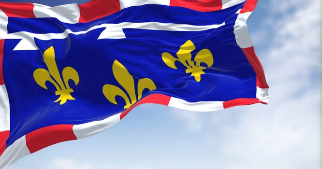 View of the Centre Val de Loire flag waving in the wind on a clear day. Centre-Val de Loire is one of the eighteen administrative regions of France. Selective focus.