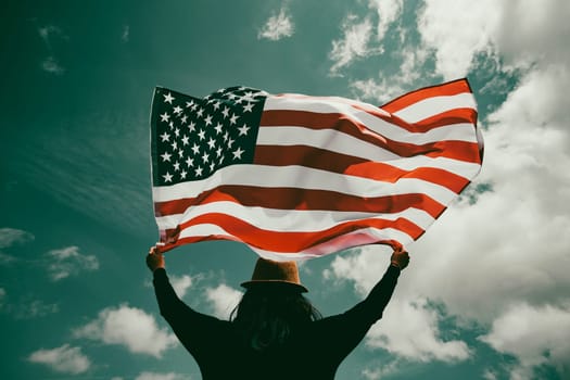 Young woman holding american USA flag. Independence Day or traveling in America concept.