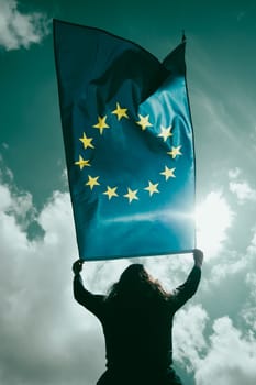 Young woman holding European Union flag. Voting, election concept.