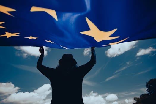 Young woman holding European Union flag. Voting, election concept.