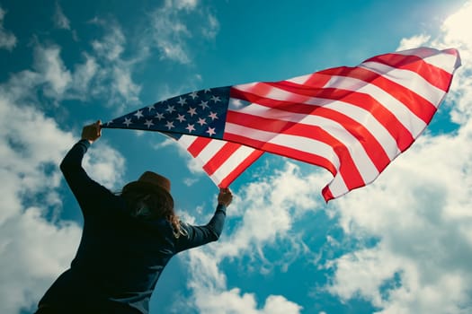 Young woman holding american USA flag. Independence Day or traveling in America concept.