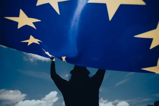 Young woman holding European Union flag. Voting, election concept.